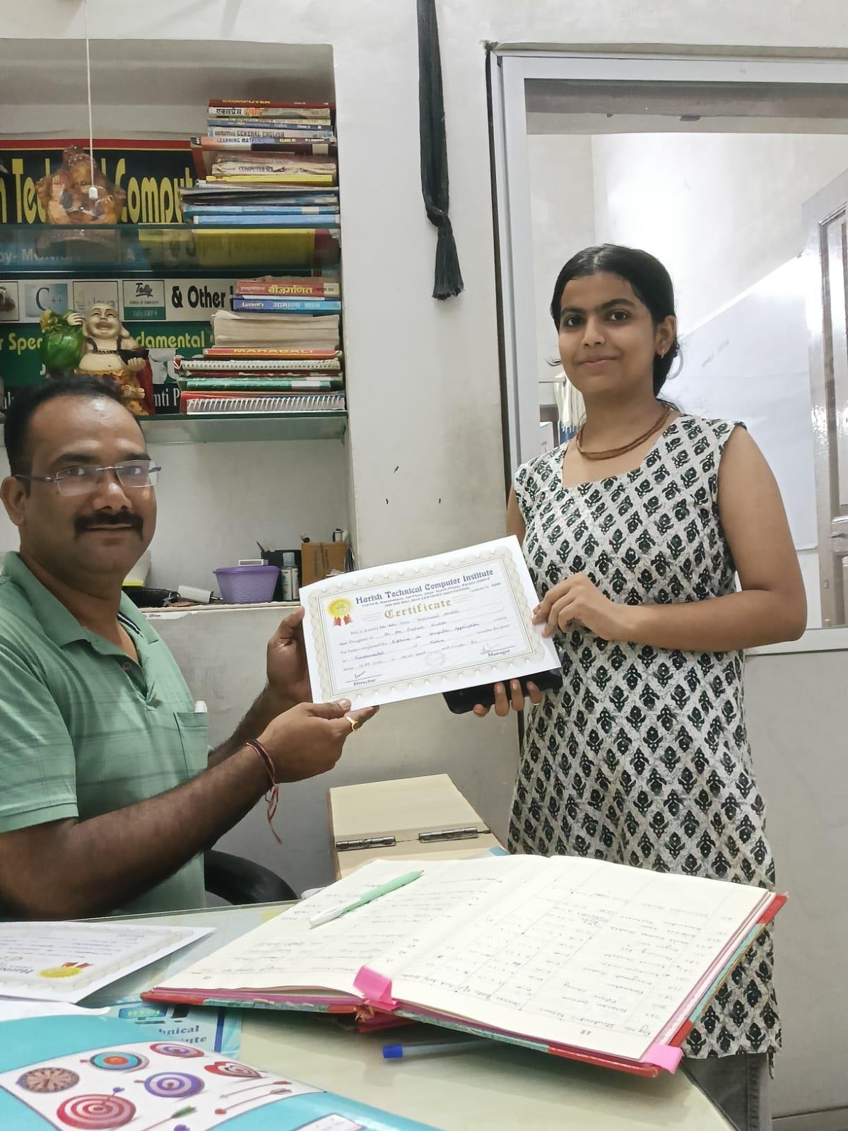 Student holding HTCI certificate