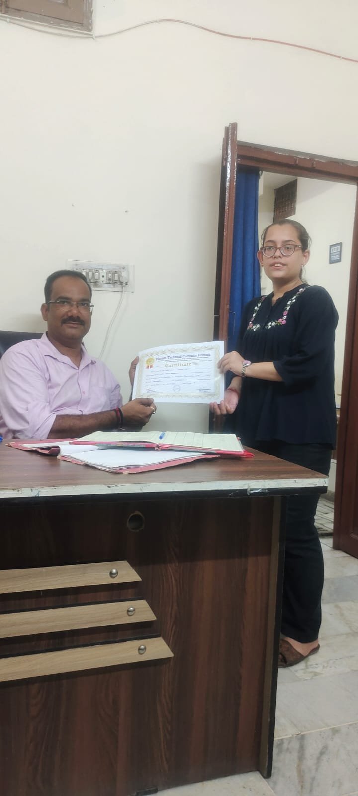 Student receiving HTCI certificate